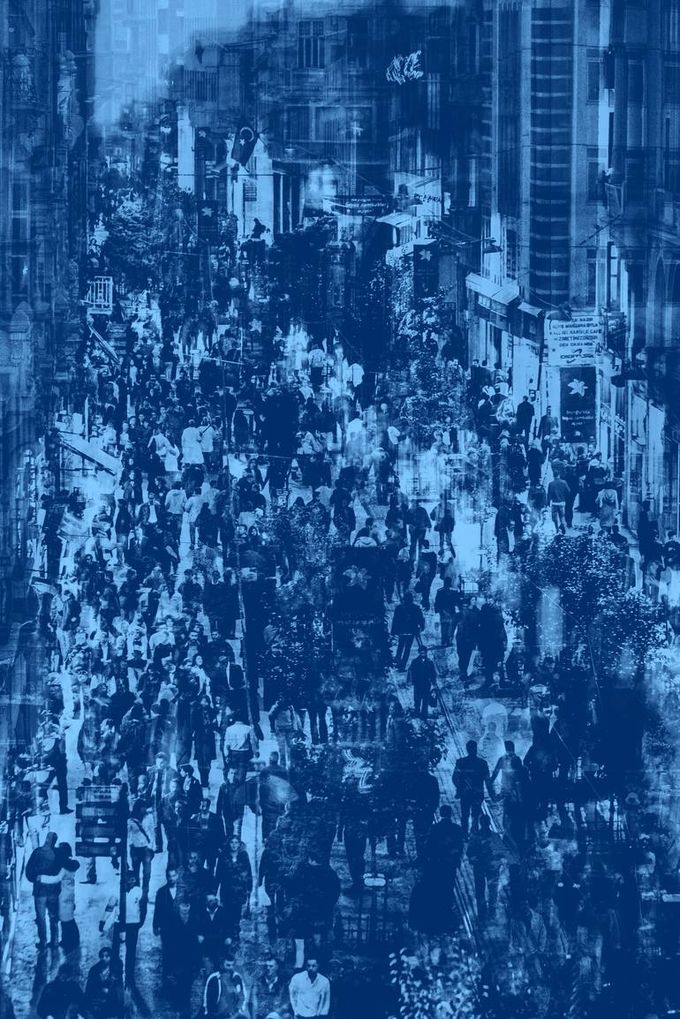 A double-exposed photograph of a crowded İstiklal Avenue, Beyoğlu, İstanbul, rendered in deep blue — a photograph by Hulki Okan Tabak